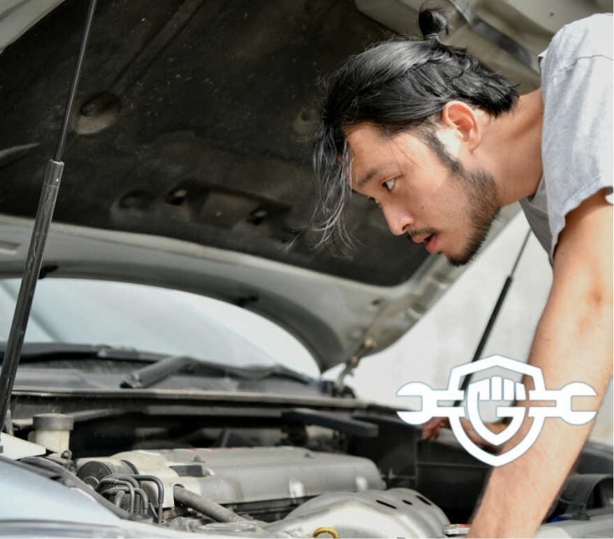 Driver experiencing car trouble from a sputtering engine on the road.