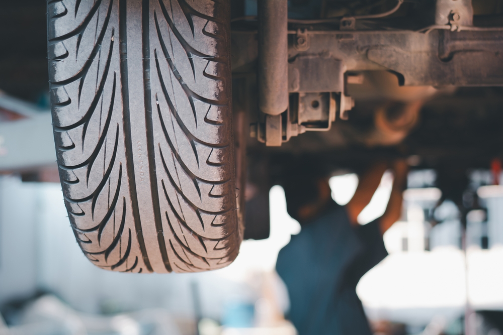 tire being rotated on a lift