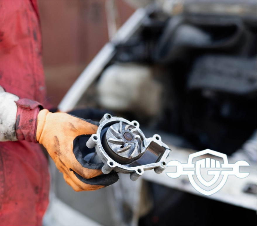 new water pump being installed in a car