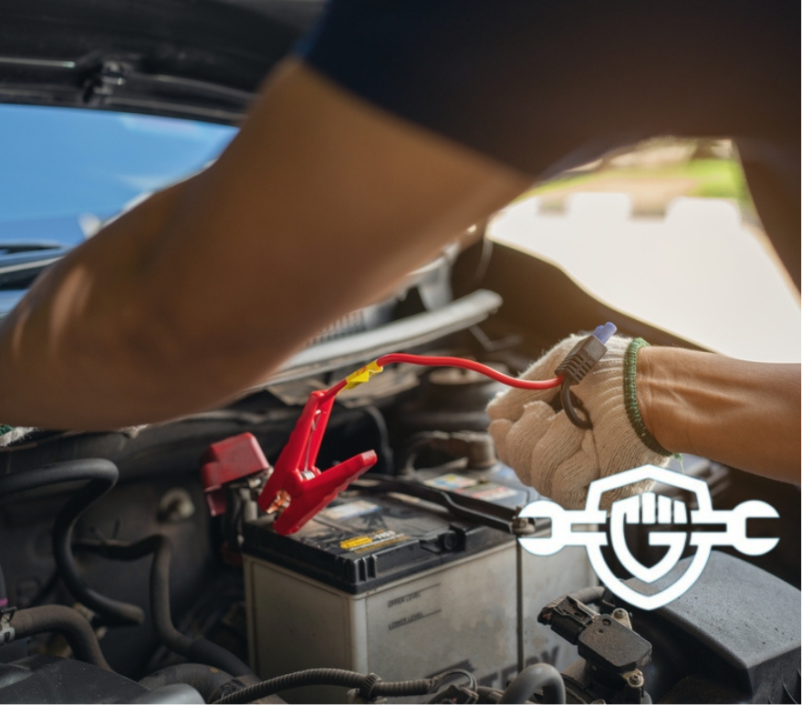 Close-up of mechanic holding voltmeter to check voltage car battery energy problem for service maintenance. Car mechanic noting repair parts during open car hood engine repair unrecognisable 