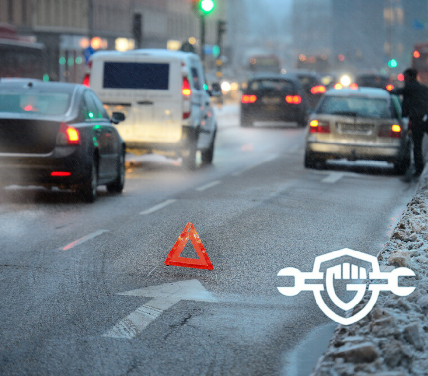 cars driving in cold snowy weather, breaking on the road