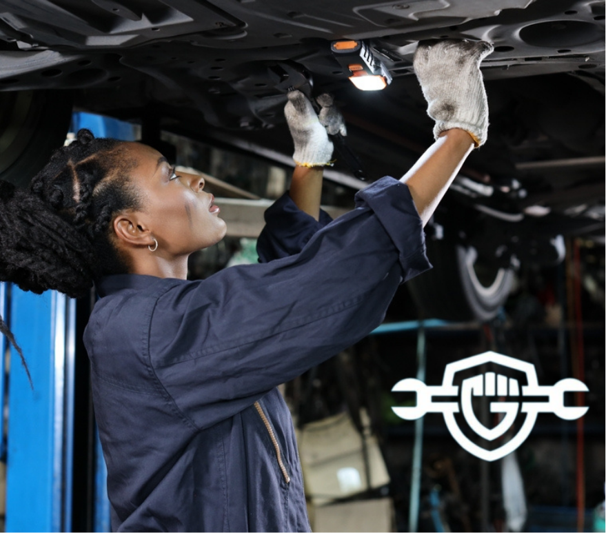 female mechanic giving a check up to a car