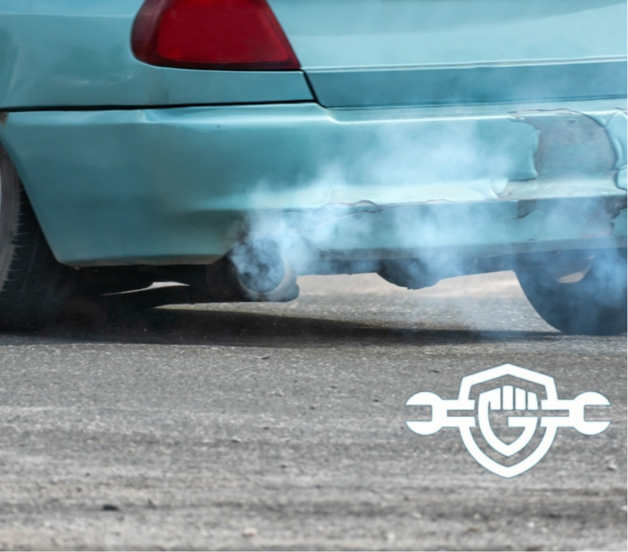 Smoke coming from a car exhaust pipe due to burning oil