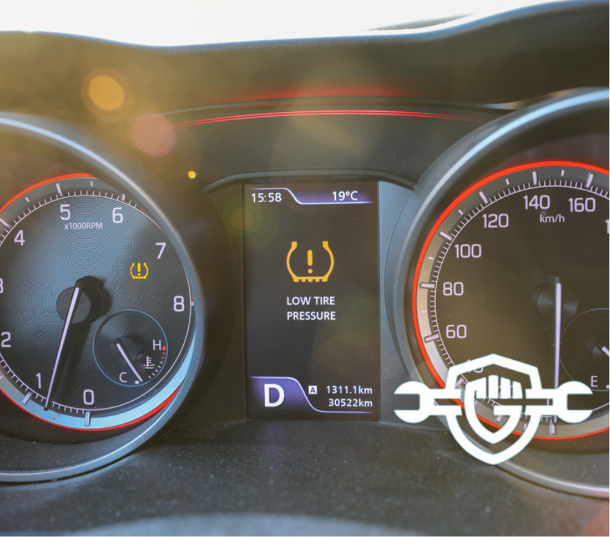 Low tire pressure error sign. Warning lights flash on the car dashboard. 