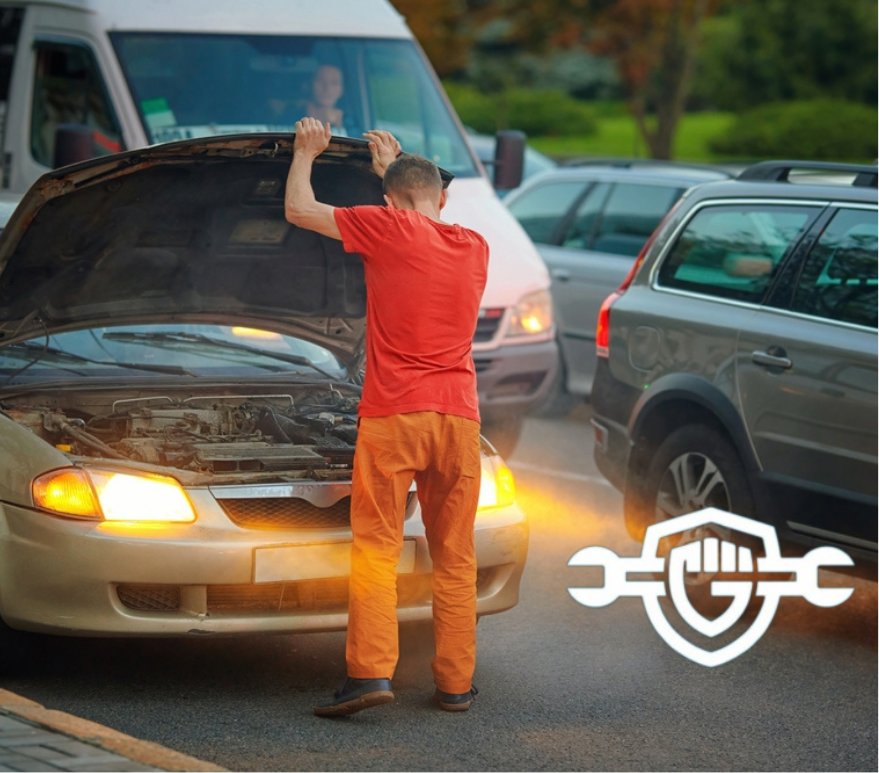 car overheating in traffic, owner looking at the engine
