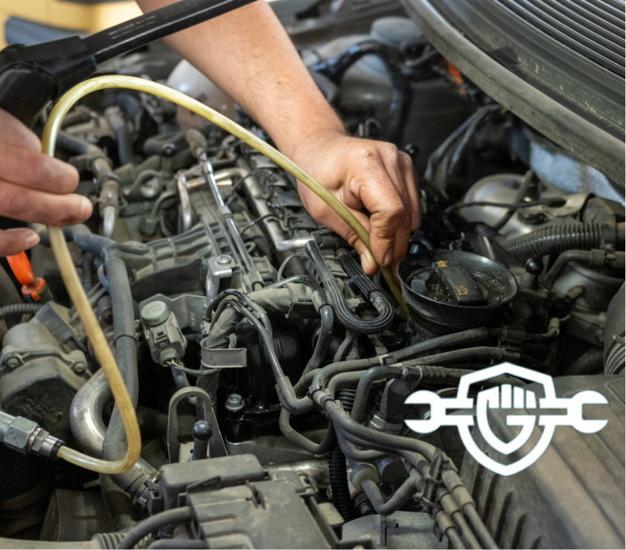 photo of a mechanic's hands repairing a car diesel engine
