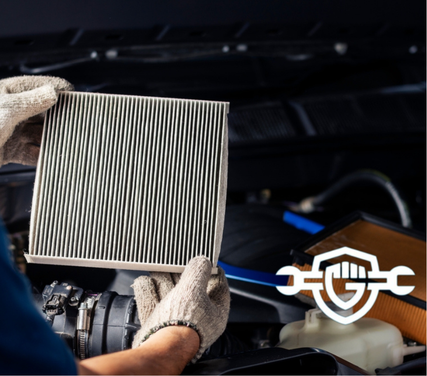 Repair and check car air conditioning system Technician holds car air filter to check cleanliness.