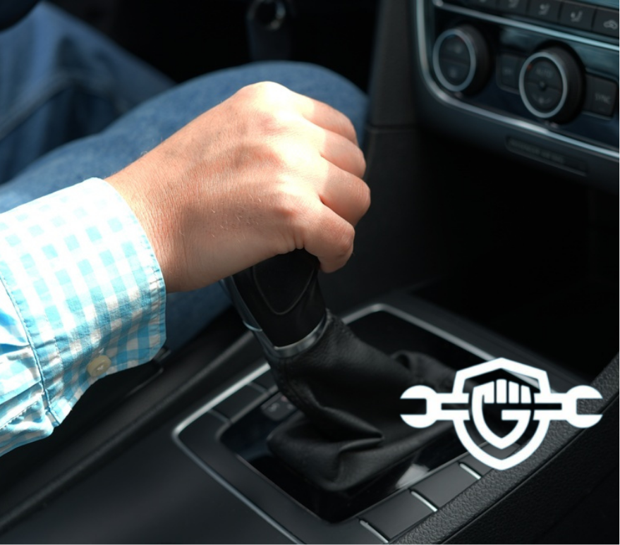 Close up of driver hand shifting manual gear stick inside car, transportation and driving concept, vehicle control and automotive interior details
