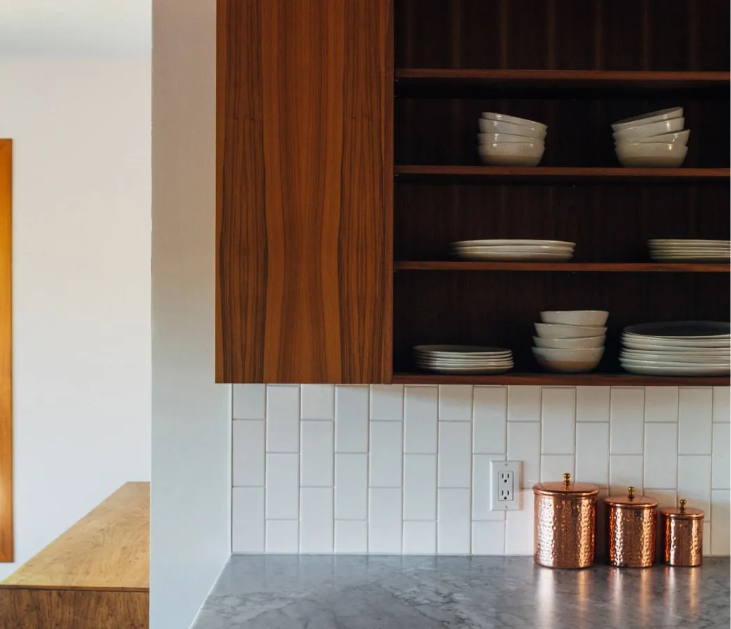 Bowls in wooden kitchen shelf