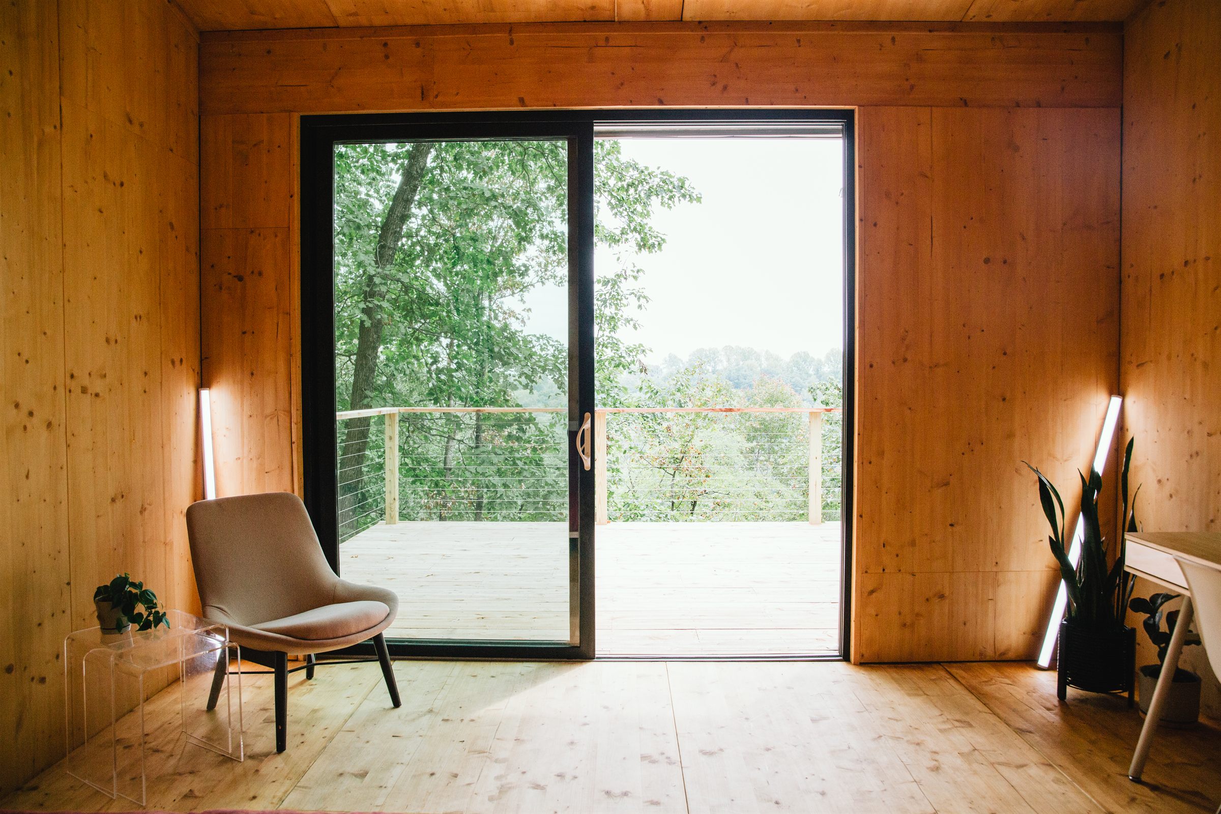 Cabin construction site with structural framing and large window openings