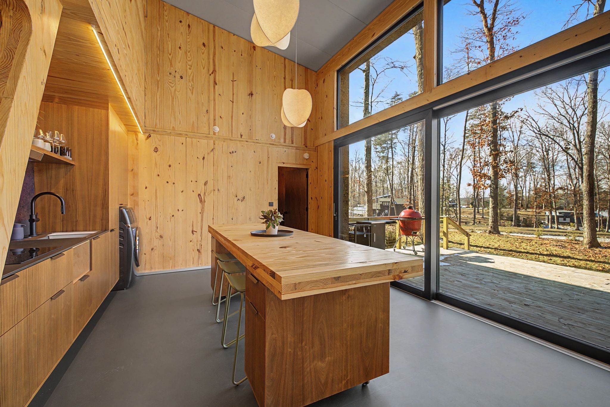 Aera home living space with large windows and minimalist design