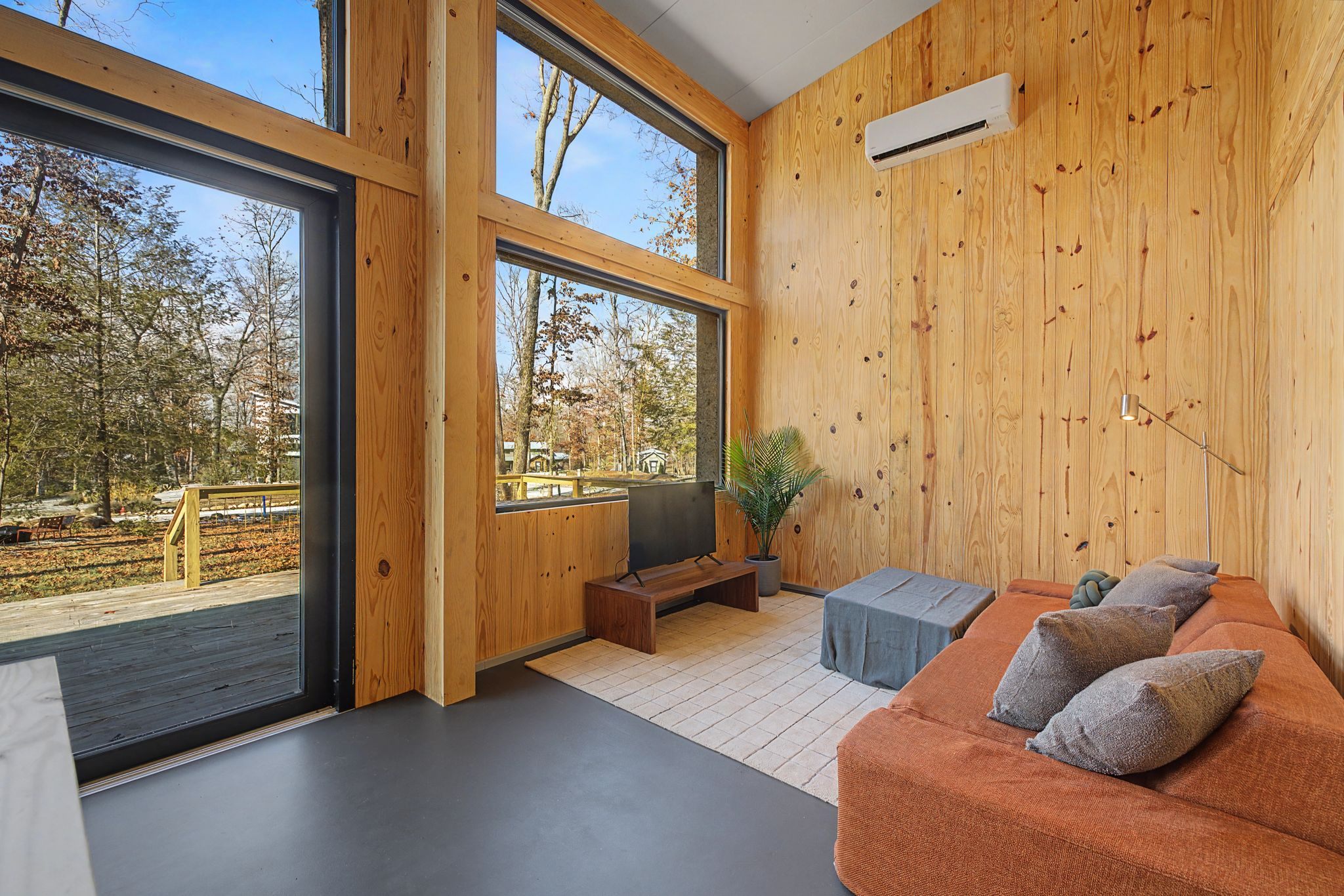 Aera home interior with warm wood finishes and natural light