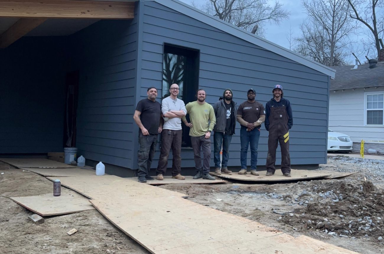 The Aera team gathered at a completed Intunity home