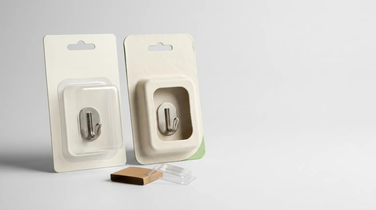 Two eco-friendly blister packaging options displayed side by side on a clean, light grey background.