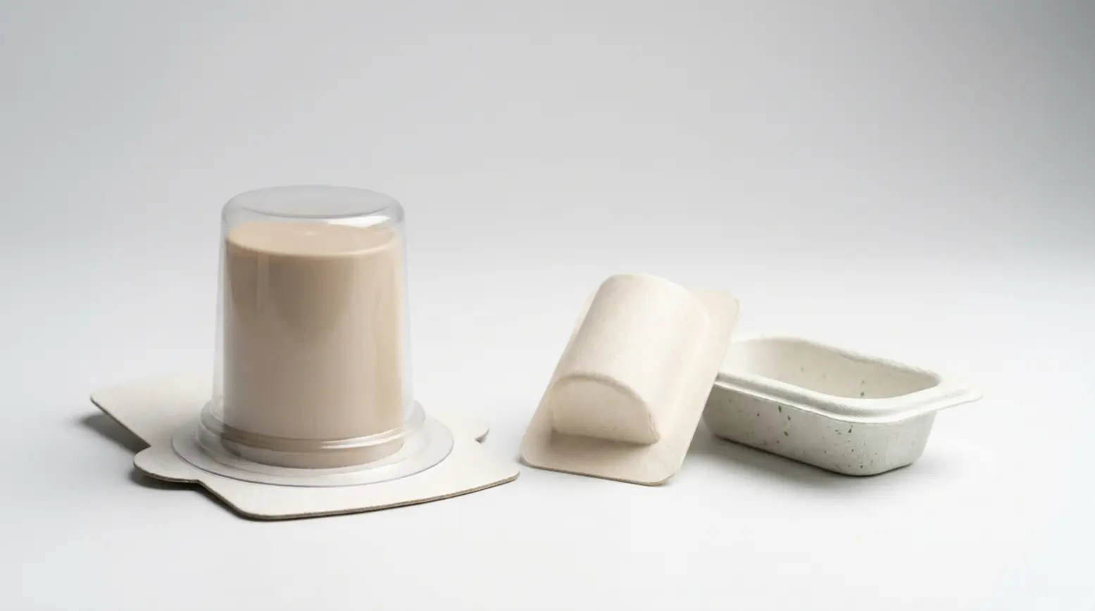 Panoramic comparison of three eco-friendly packaging designs on a clean, minimalist backdrop.