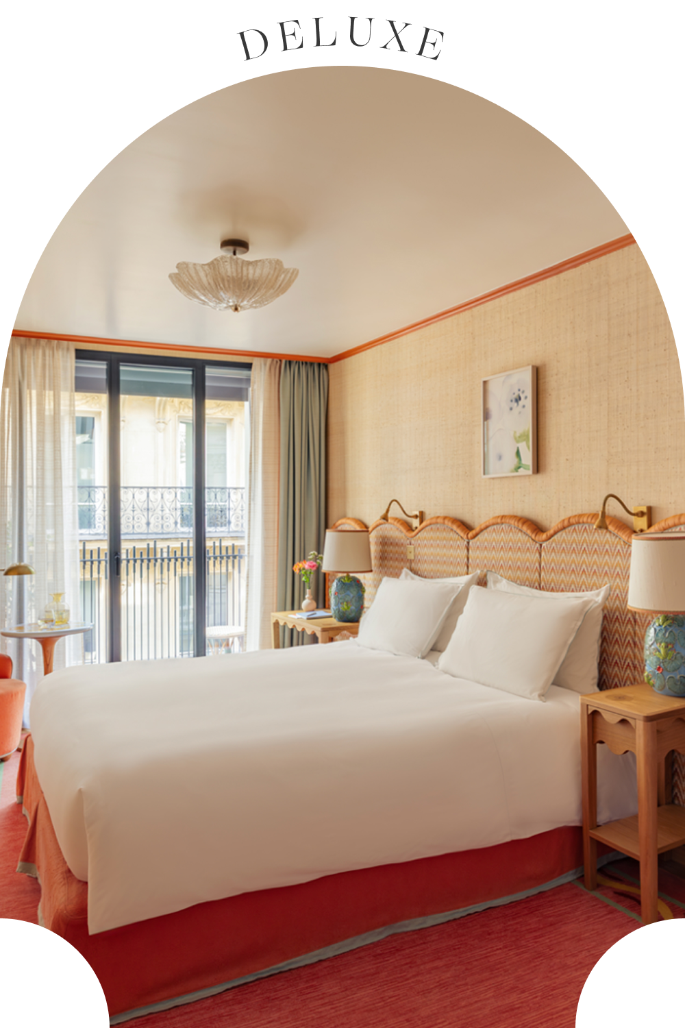 Detail of deluxe room at la fantaisie with bed and green lamp