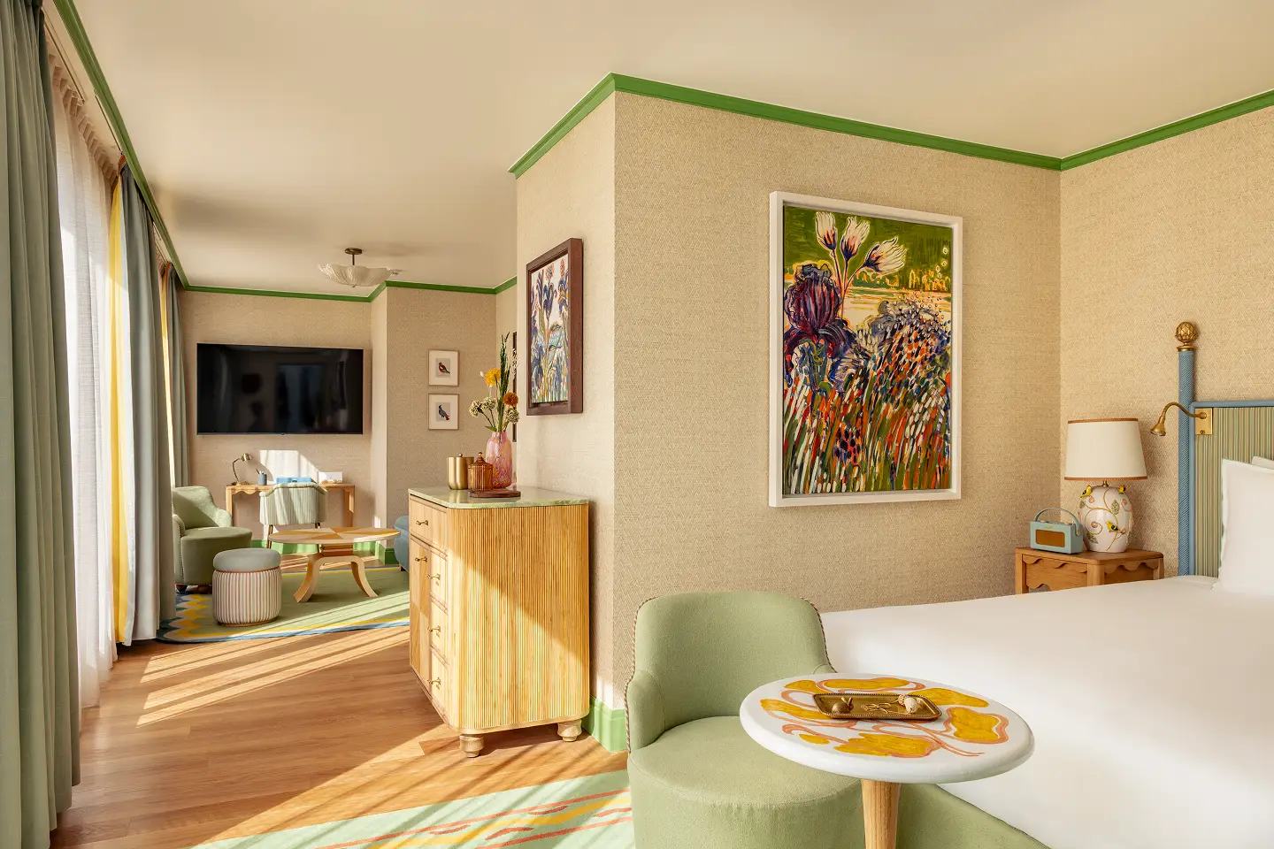 inside of suite terrace at la fantaisie table and chair in the forefront and views opening onto the terrace