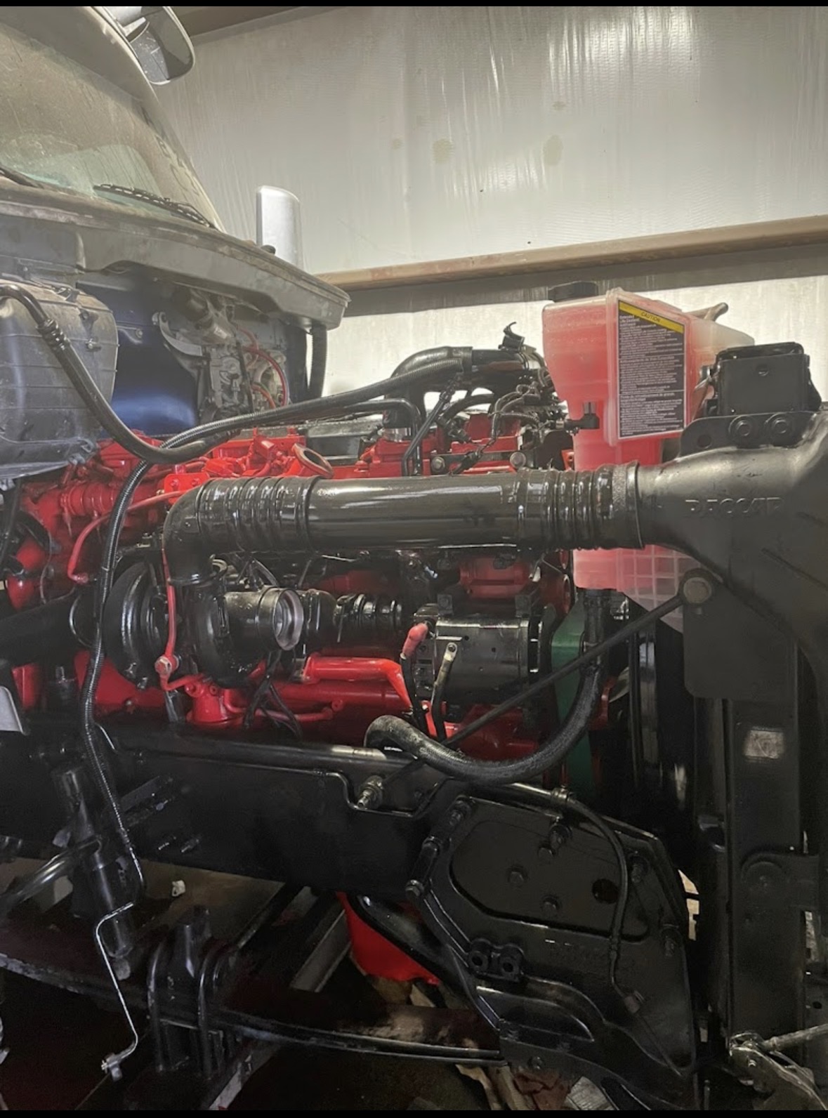 Diesel mechanic performing Specific modifications on a semi truck in Midland, TX