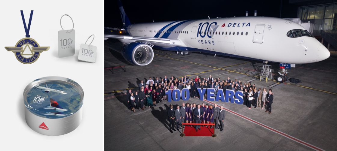 Delta employees celebrating the company’s 100-year anniversary with custom, commemorative awards designed by O.C. Tanner.