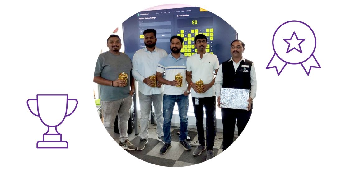 Brillio employees holding a custom award during a recognition moment