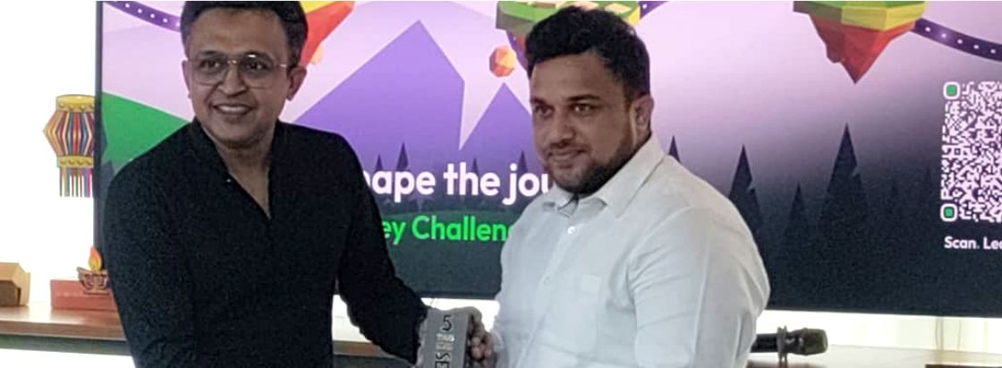 Brillio employees holding gifts during a recognition moment