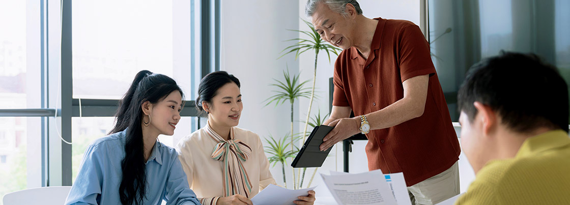 A businessman leading a meeting in an office