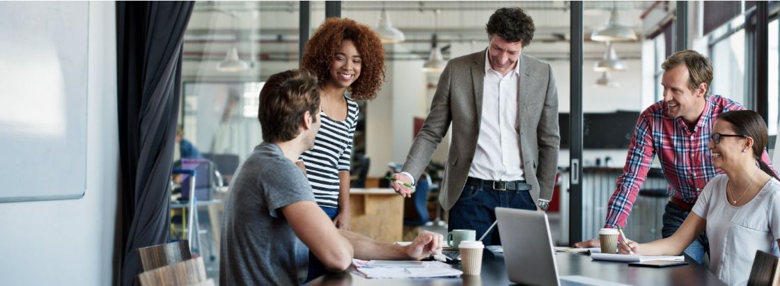Employees in a meeting room together
