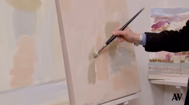 Person painting abstract soft pastel color blocks on a canvas in a studio.