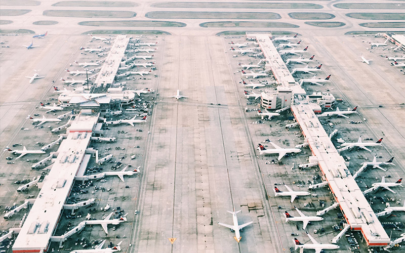 Airport terminals with lots of aeroplanes
