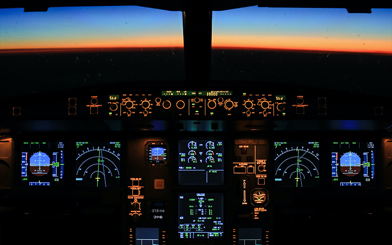 Interior of a plane cockpit at dusk