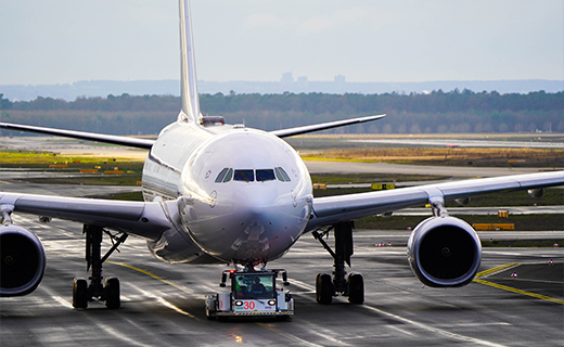 Aeroplane being taxied down the runway