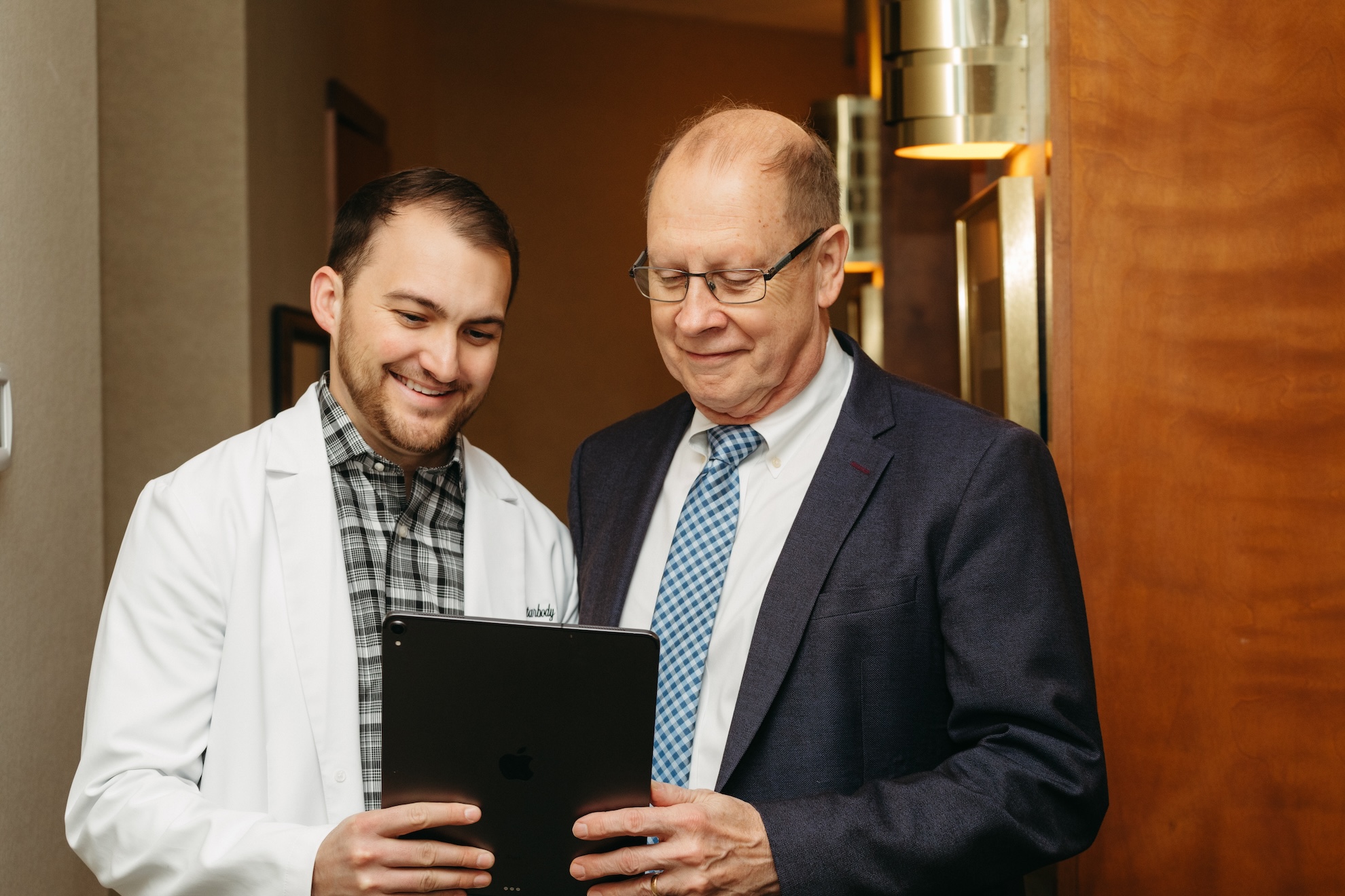 Dr. Starbody discussing treatment options with senior patient.