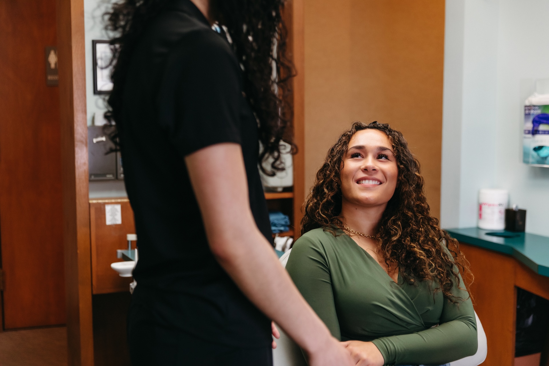 Female patient smiling a bright flashy smiles at Dr. Michael Starbody in the Starbody Dental office