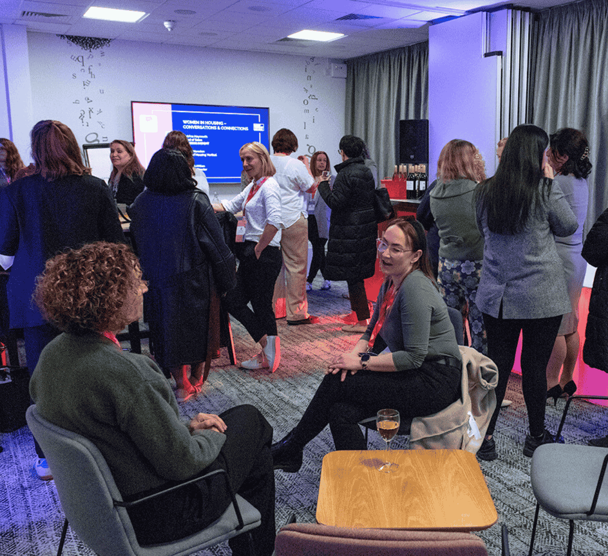 Image of George Grant and Alastair Tweedie on stage at the Housing Technology Conference