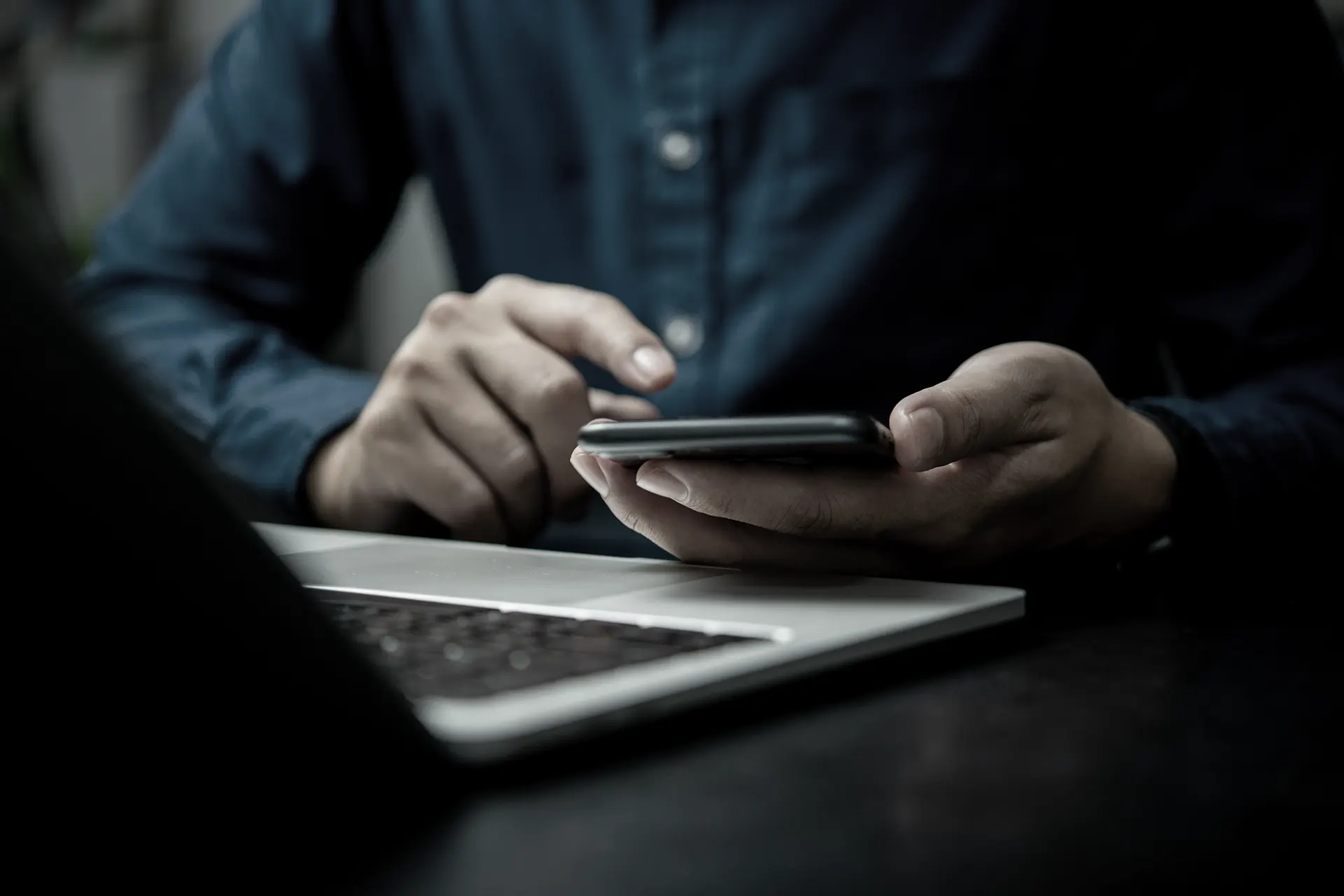 Close-up view of modern office buildings with reflective glass windows at dusk.