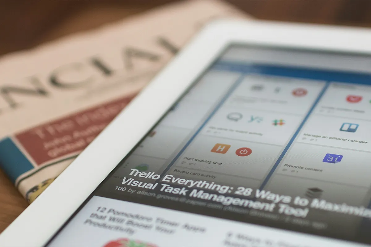 Business newspaper pages spread out, representing issues and crisis coverage