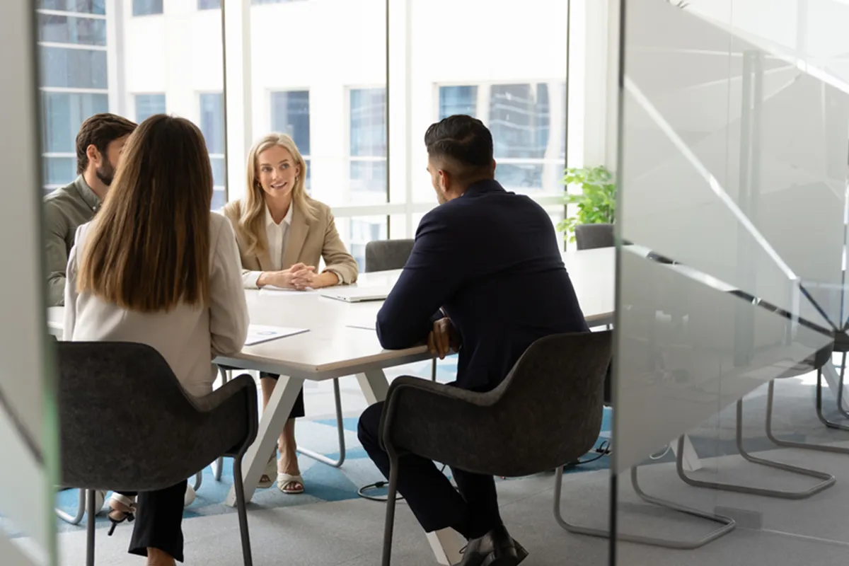 A team gathered around a table working through a scenario together