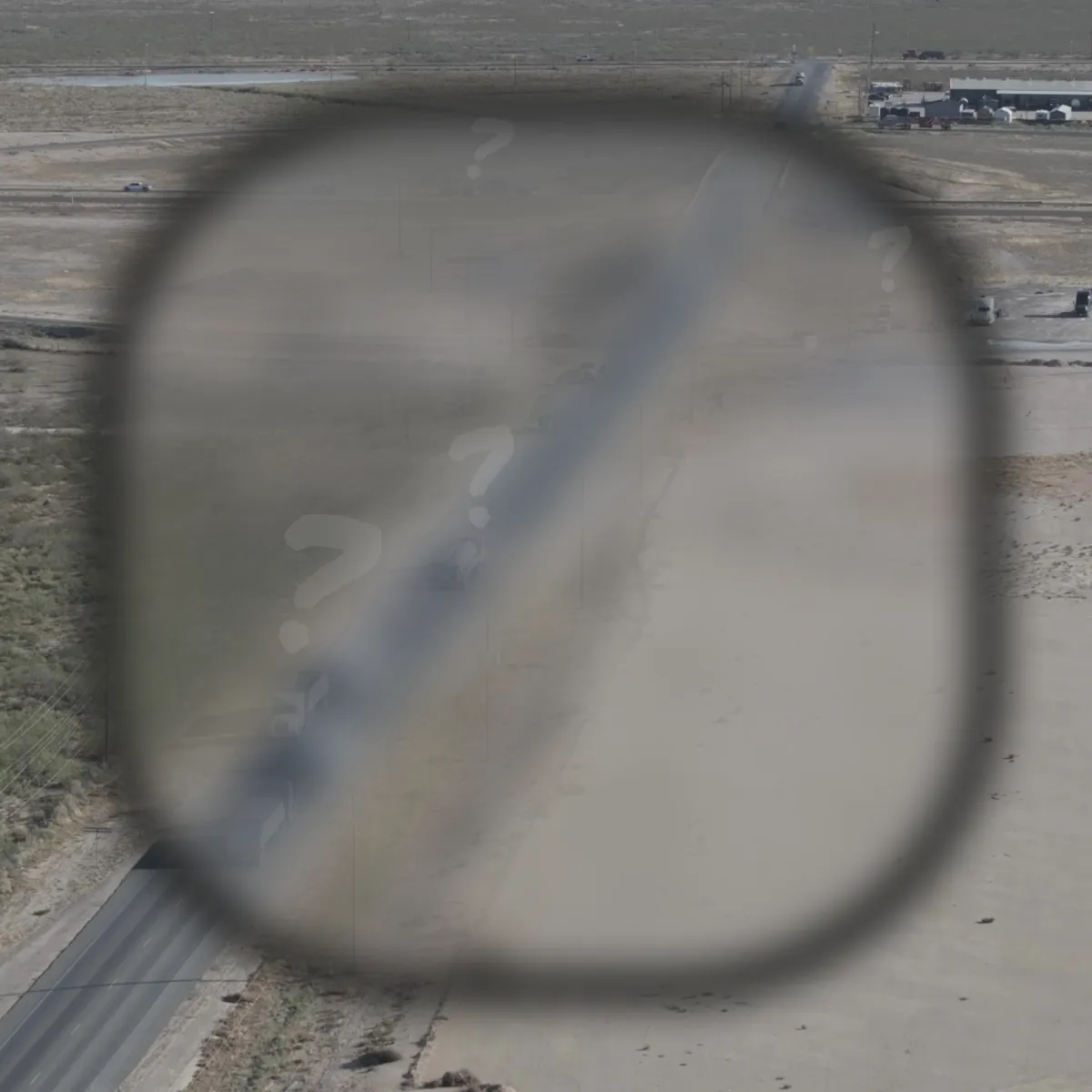 A visual showing a blurred view of an oilfield, representing lack of field level visibility
