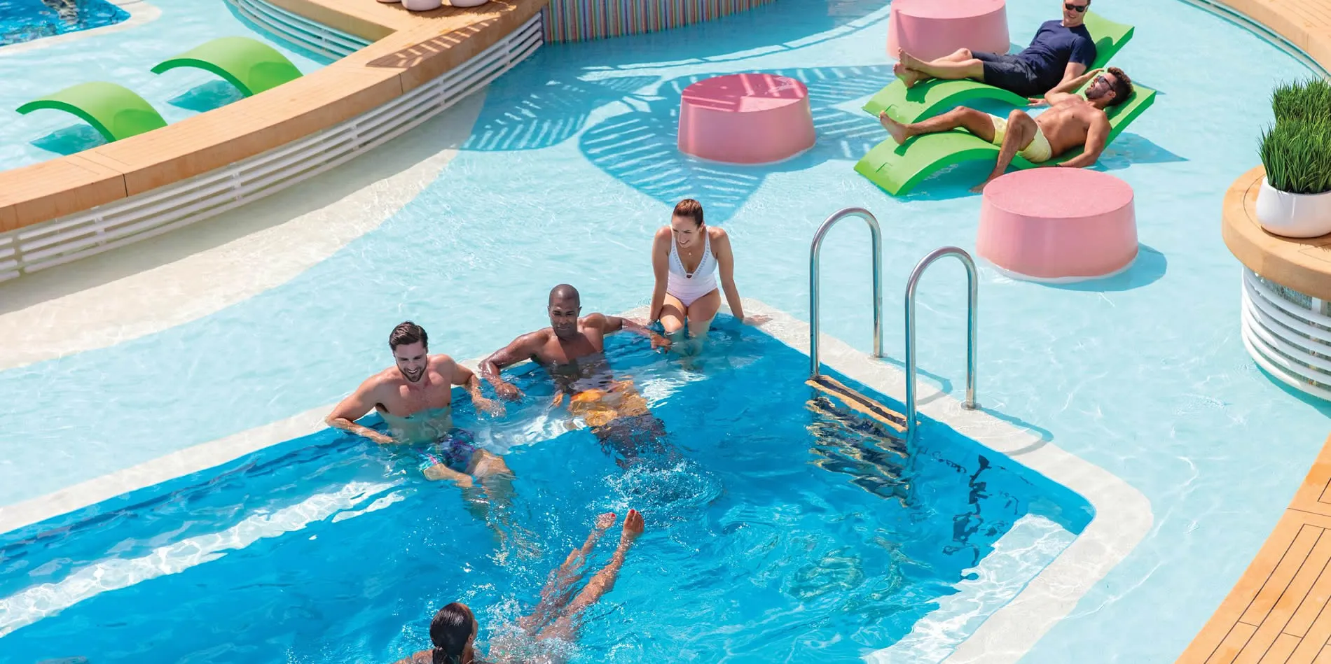 Stylish swimming pool with people relaxing on floats and in water