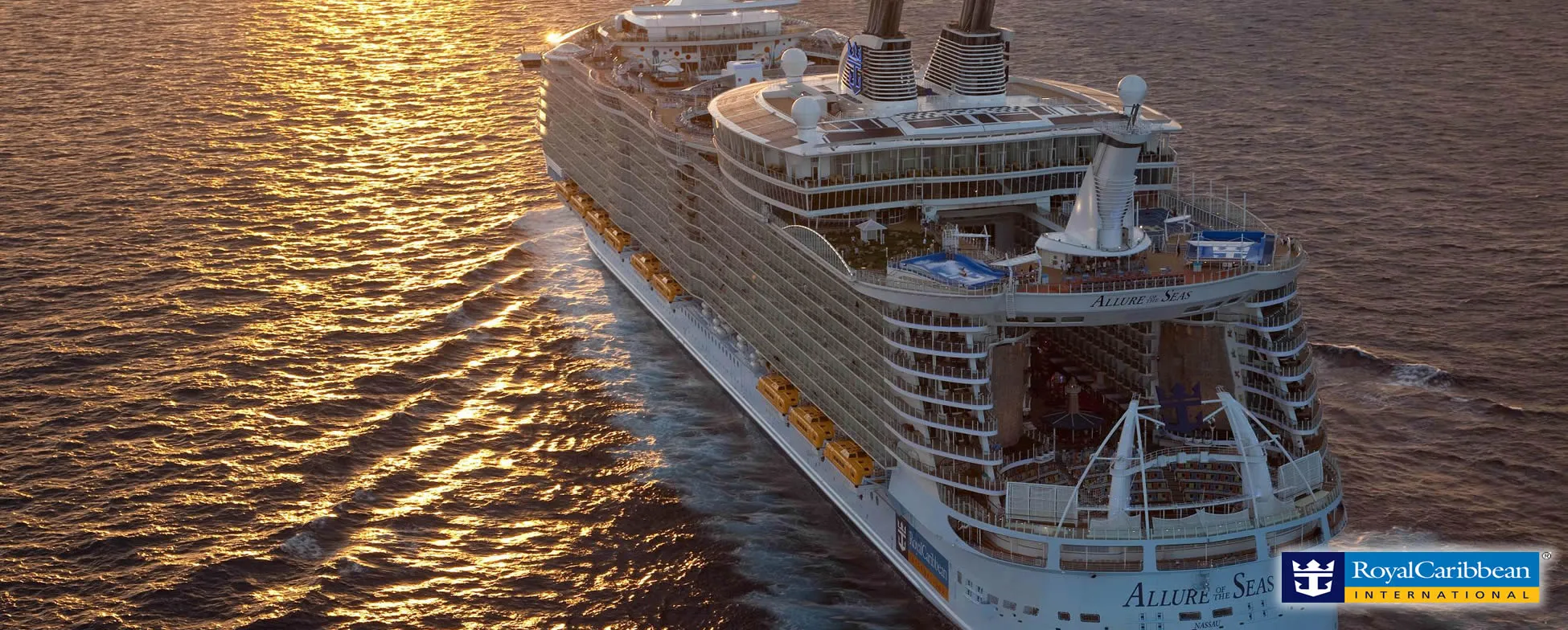 Large Royal Caribbean cruise ship Allure of the Seas sailing at sunset