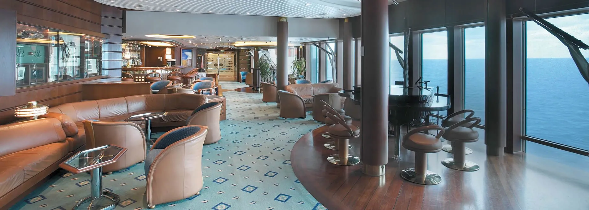 Luxurious cruise ship lounge with ocean view and leather seating