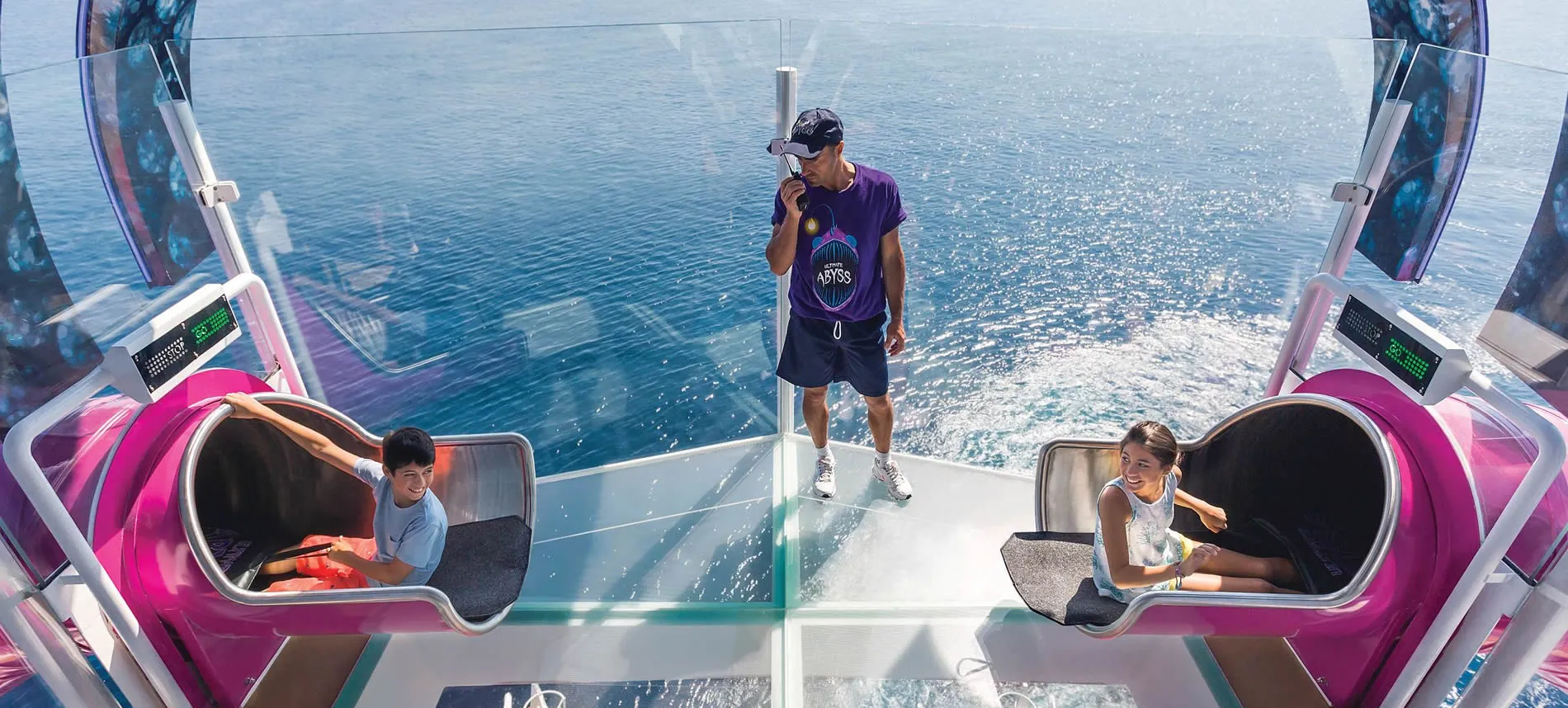 People riding modern water attraction with ocean view and sparkling water