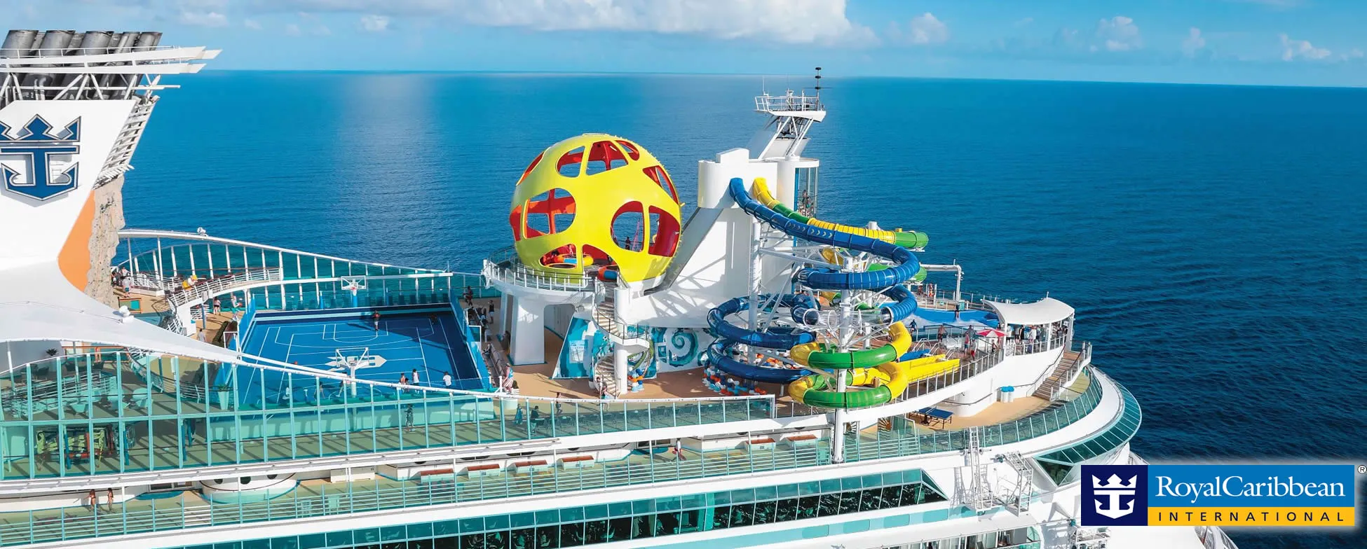 Royal Caribbean cruise ship with colorful water slides and observation pod at sea