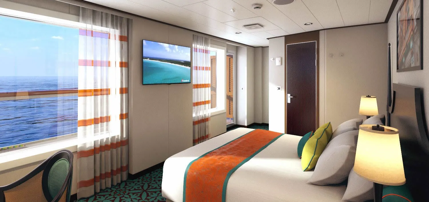 Cruise ship cabin with ocean view, colorful decor, and comfortable bed