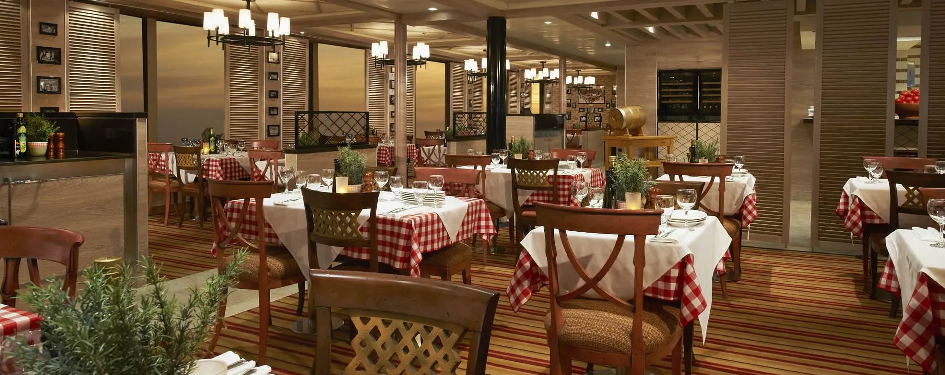 Elegant restaurant interior with red checkered tablecloths and warm lighting