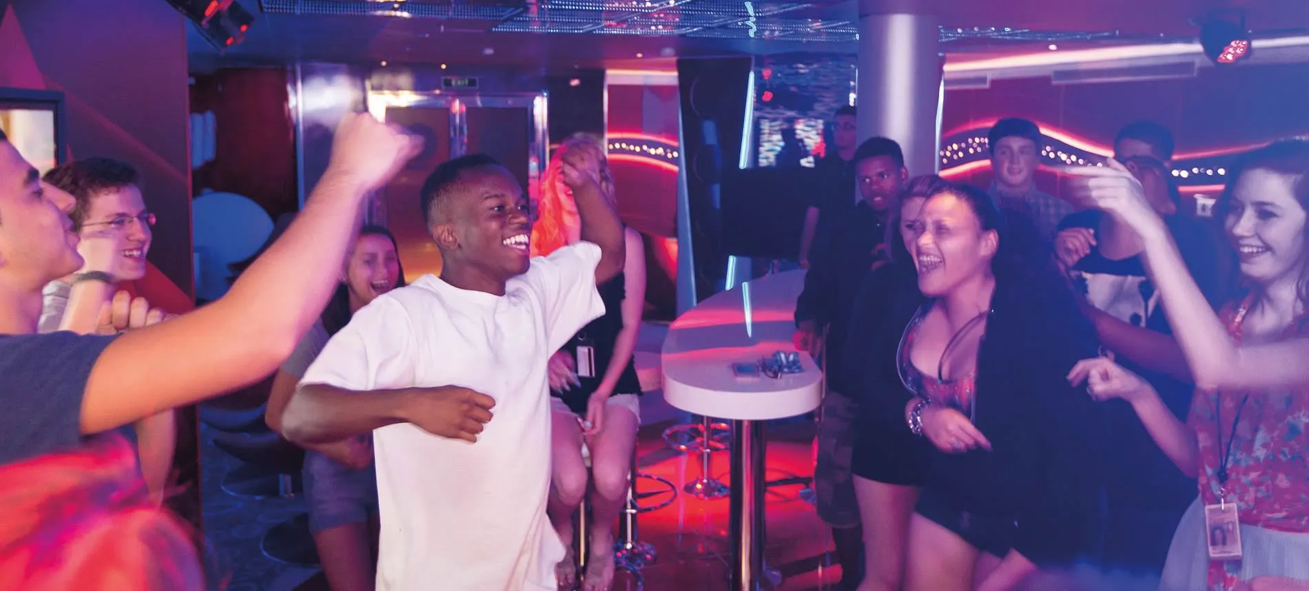 Young people dancing and enjoying themselves in a vibrant nightclub