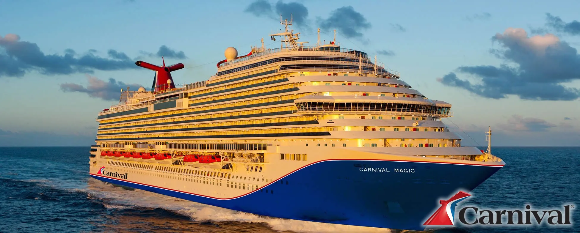 Carnival Magic cruise ship sailing on ocean at sunset