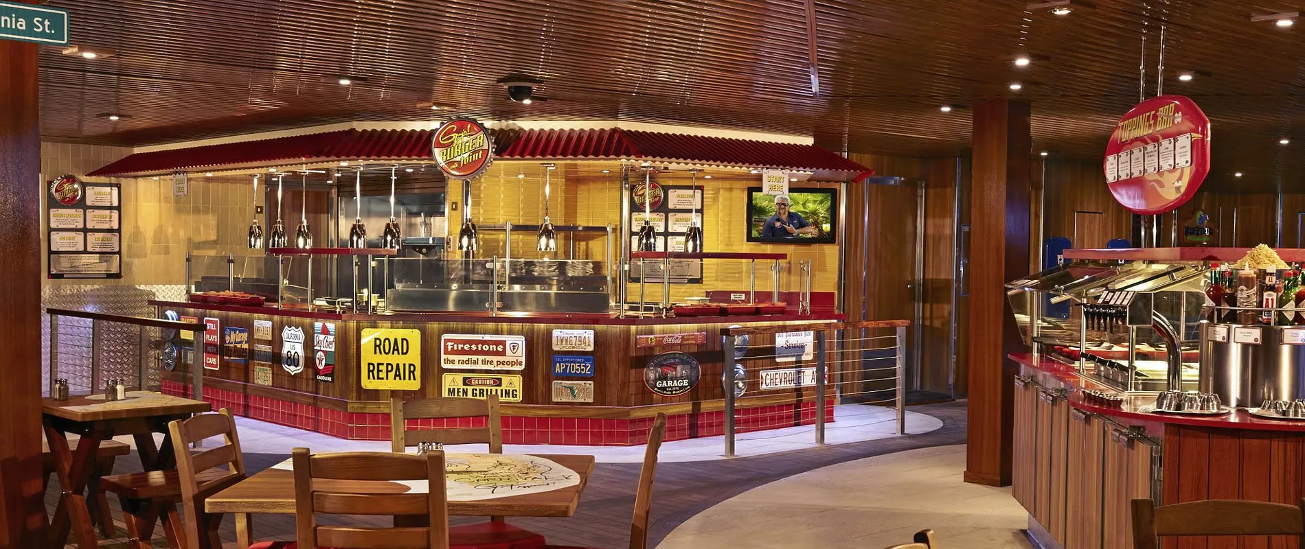 Retro-styled burger restaurant with automotive decor and red counter