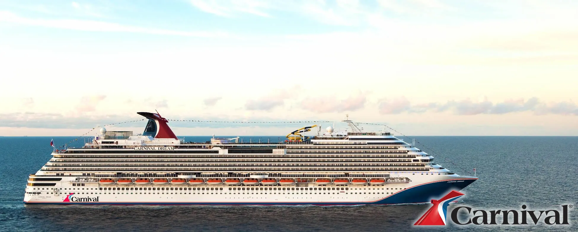 Large Carnival cruise ship sailing on blue ocean under cloudy sky