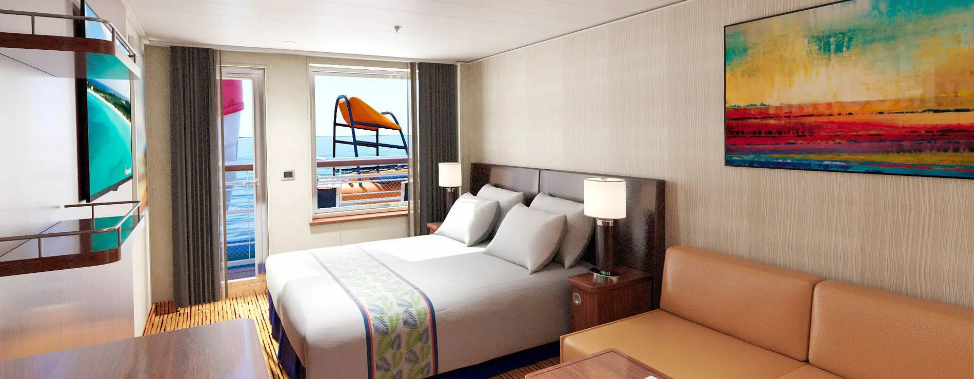 Cruise ship cabin with bed, balcony, colorful artwork, and ocean view